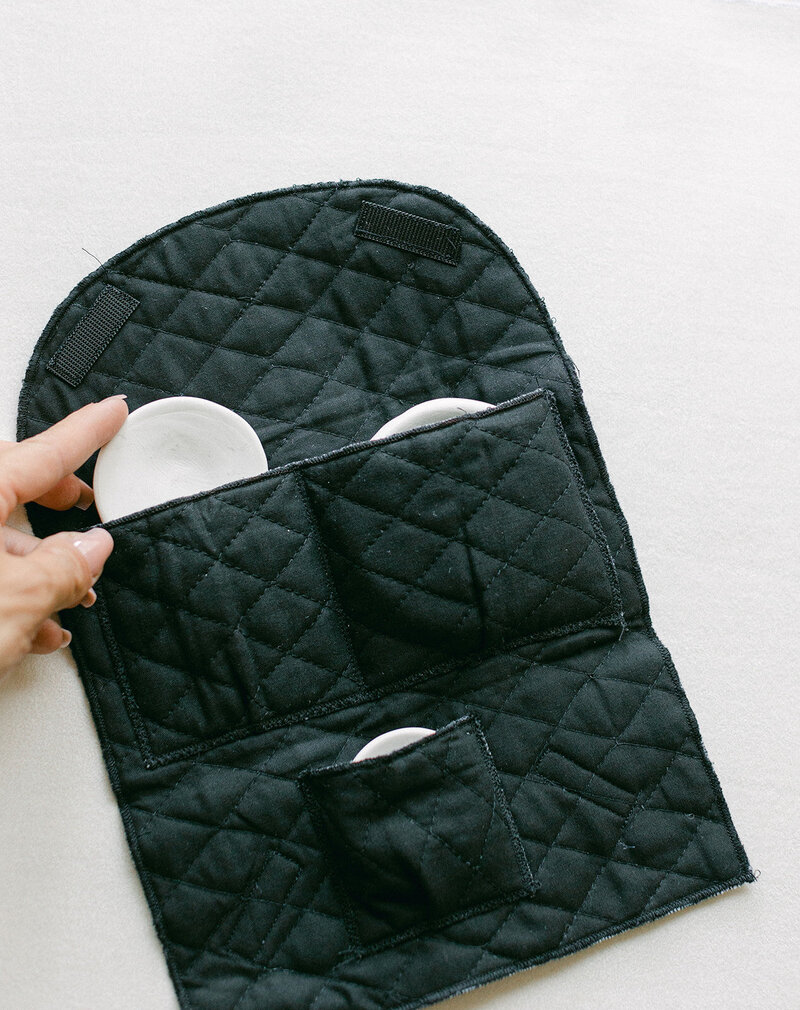 Handmade ceramic dishes used to organize accessories in flat lay photography