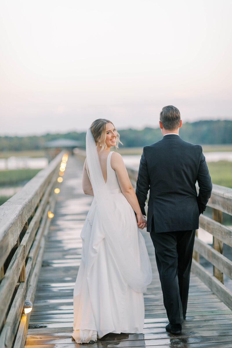 Smiling bride walking outside bluffton