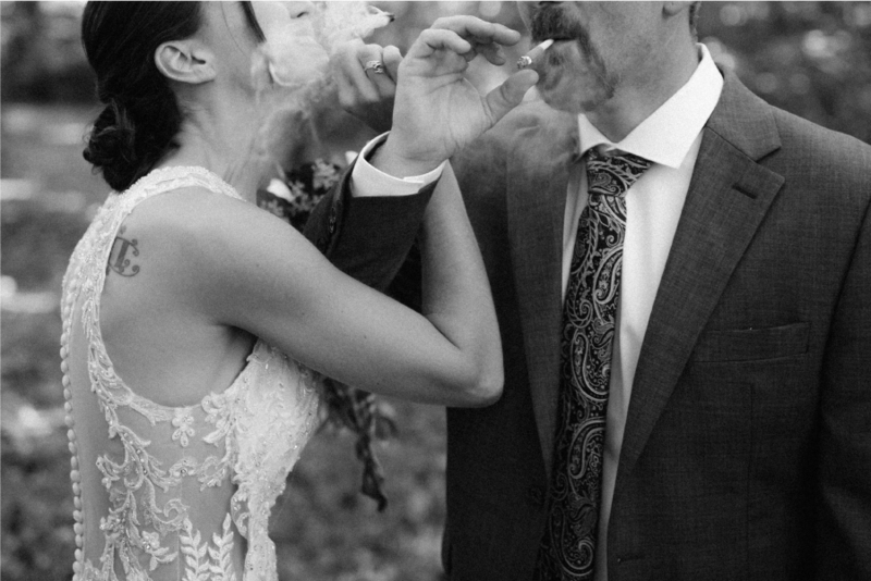 bride and groom smoking together