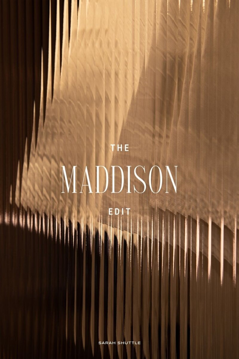 Elegant logotype for The Maddison Edit displayed over a warm-toned photo background, capturing the brand’s editorial and feminine style.