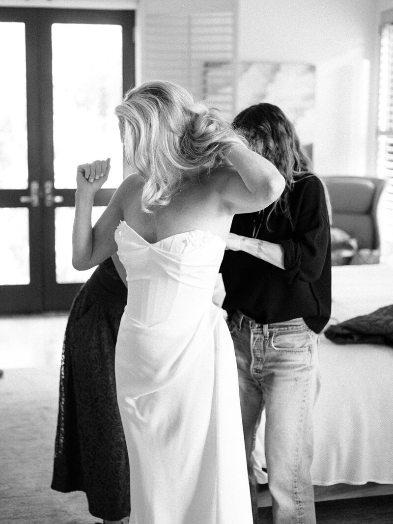 bride getting ready with her bridesmaids