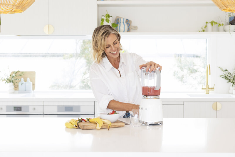 Katie Appleby enjoying a nutritious, balanced meal, showcasing how personalized nutrition coaching supports a healthy lifestyle.