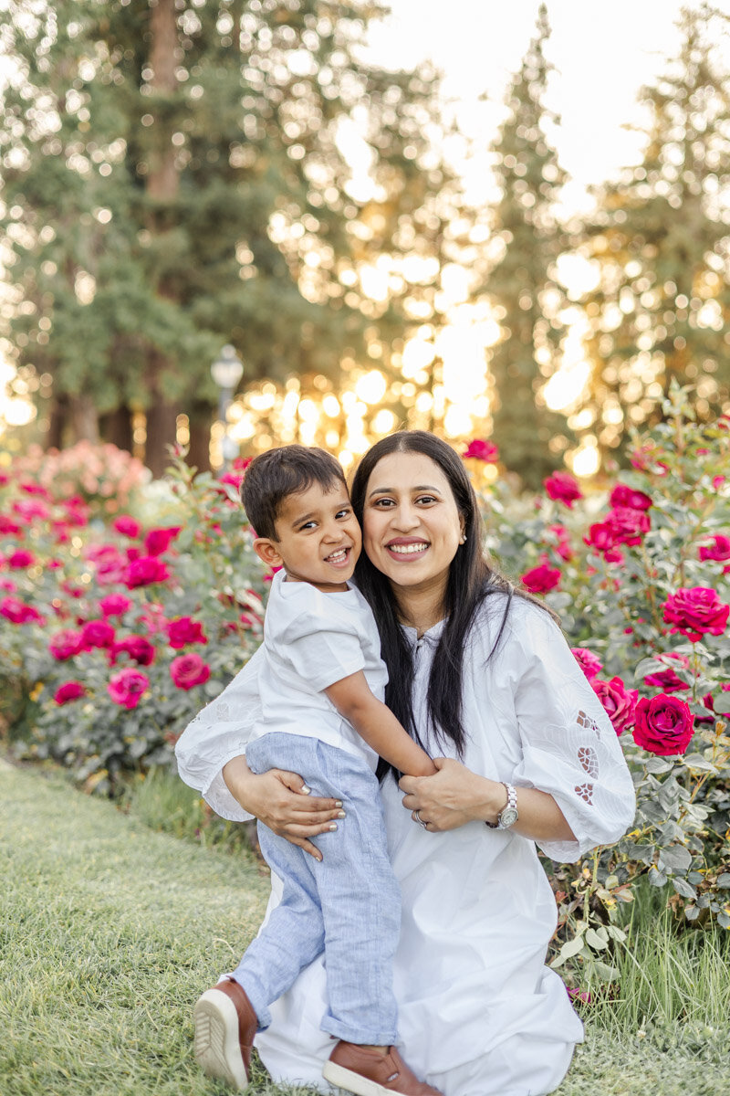 mom-son-hugging-rose-garden-golden-hour