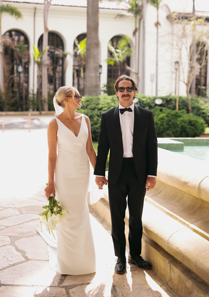 groom smitten on the beach