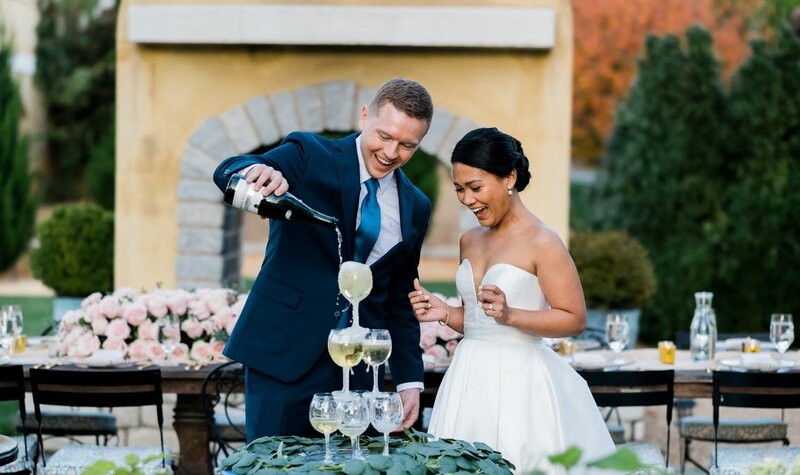 A couple pours champagne during a wedding in Central Virginia
