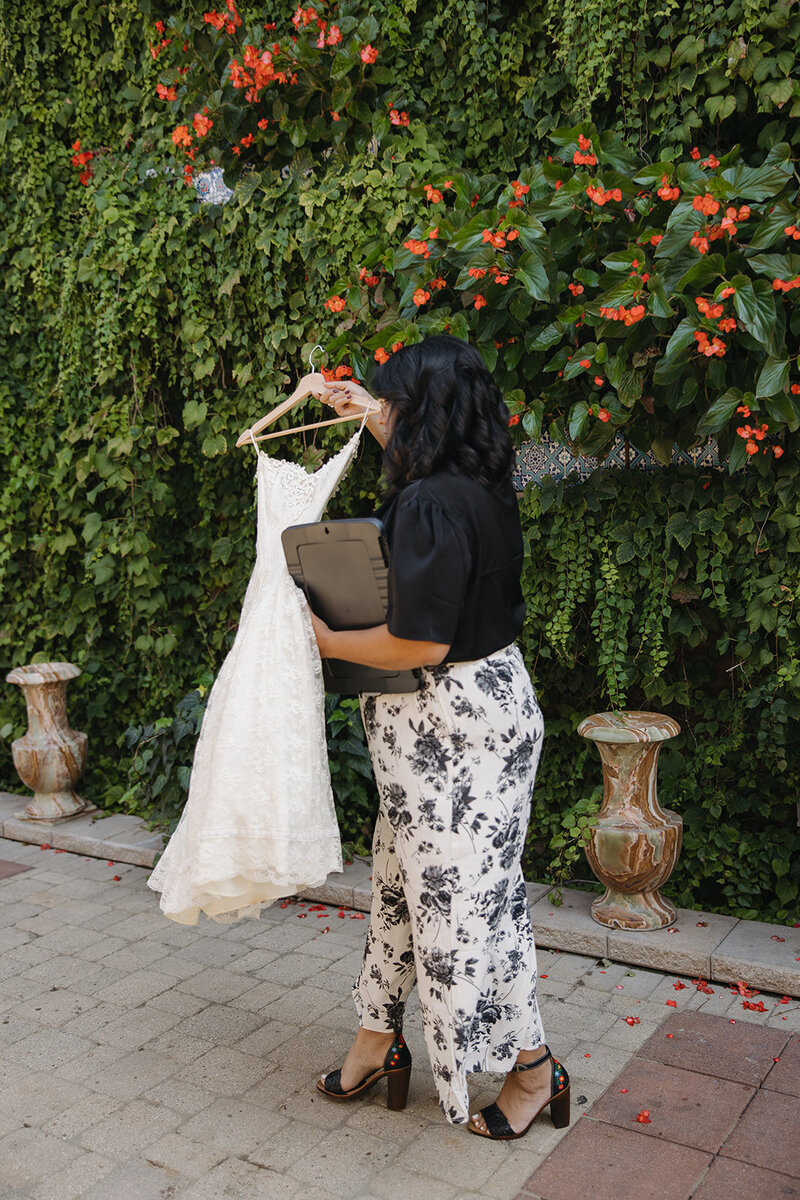 Grow your wedding business, florist student posing with florals