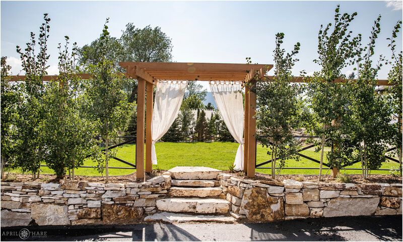 1 Entrance-to-Outdoor-Ceremony-Space-with-Terrace-at-Hearth-House-Wedding-Venue-in-Monument-CO