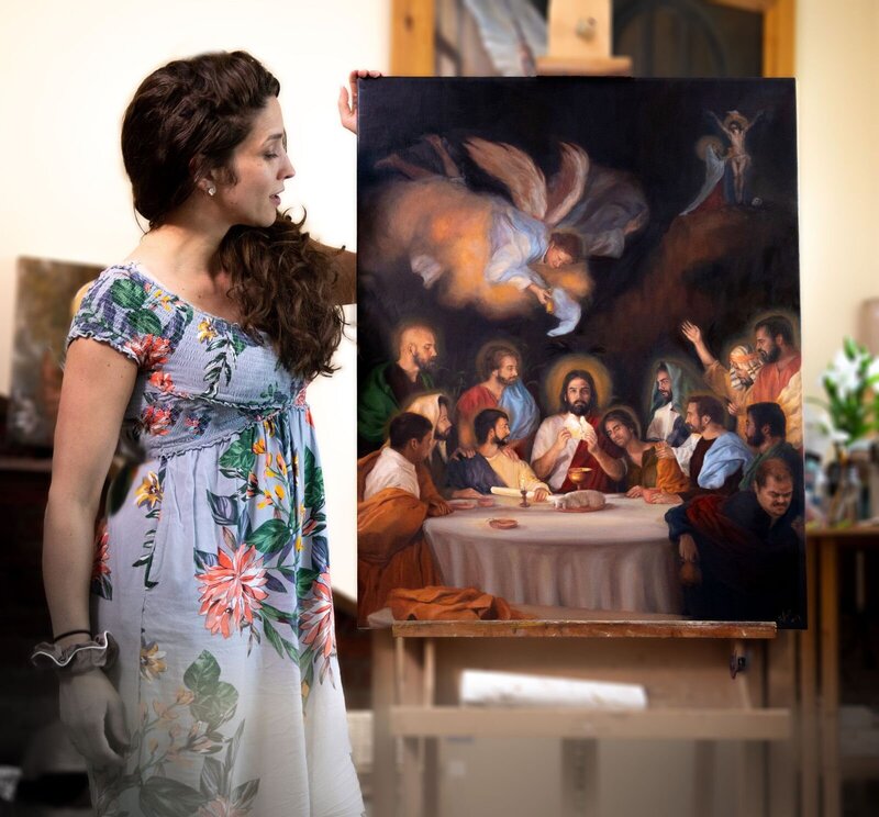woman standing with artwork