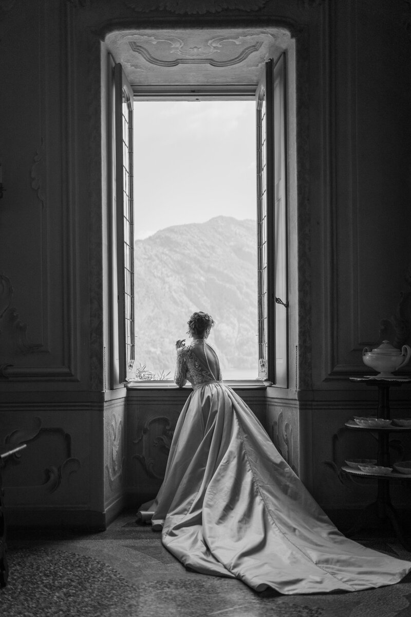 Bride looking out window, Lake Como Wedding Photographer, Renee Lemaire Photography
