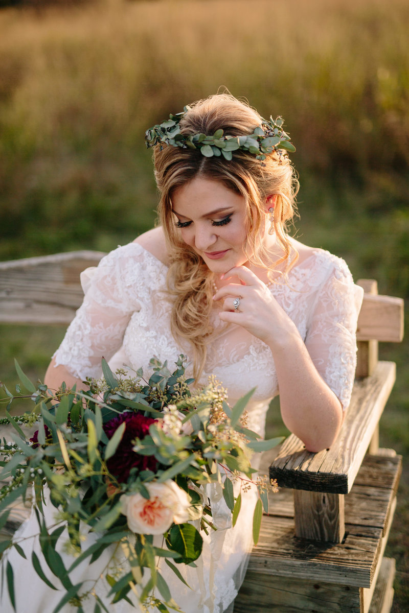 San Antonio Wedding photographer Expose The Heart Photography image of bride looking at flowers at her wedding