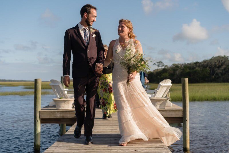 Newlyweds joyful dockside stroll