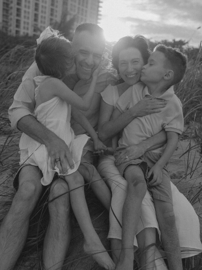 Family at the beach in South  Florida smiling at the beach. Family photoshoot.Black and white photography in Palm Beach Florida