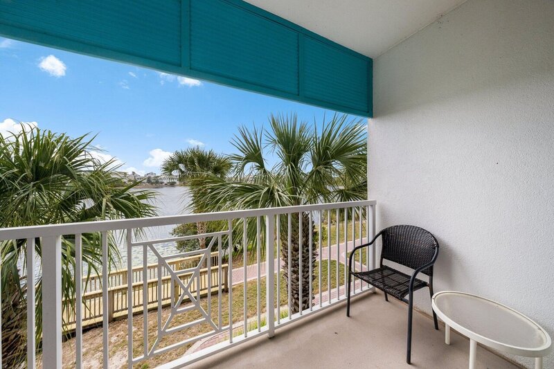 balcony over looking lake with table and chair