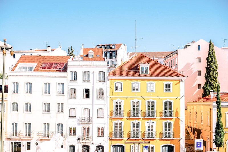 European building painted in yellow on vacation planned by travel concierge for luxury GG Mack Travels
