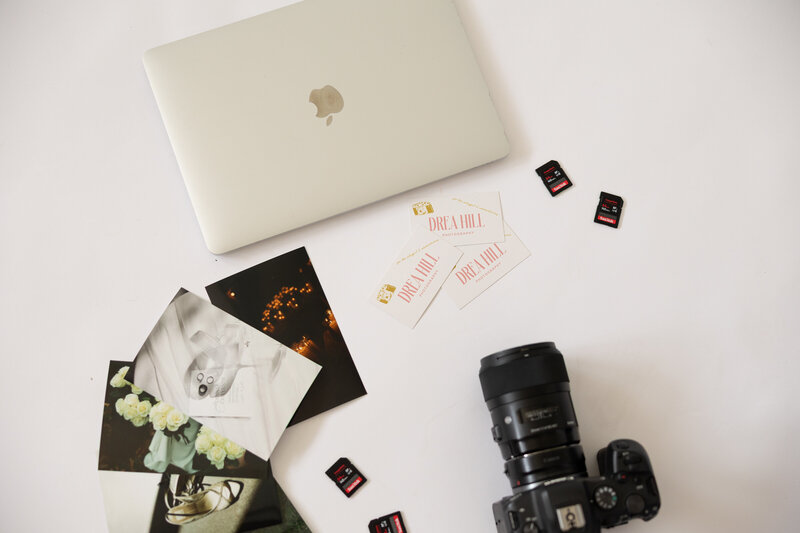Creative branding photos featuring laptop, business cards, camera, and sd cards. 
