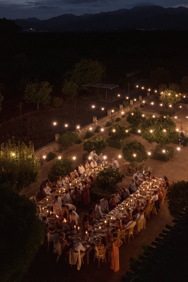 Wedding photographer captures couple taking a stroll hand in hand at their french chateau wedding.