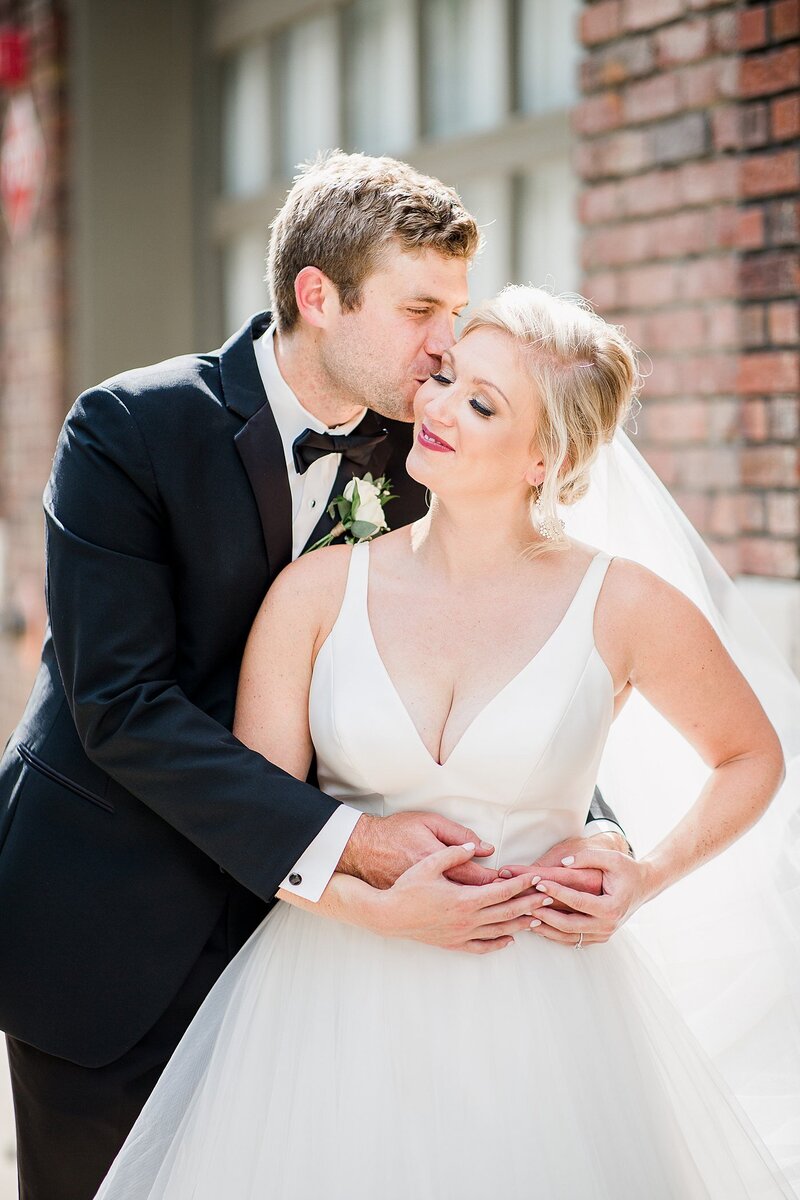 kiss on the cheek by Knoxville Wedding Photographer, Amanda May Photos