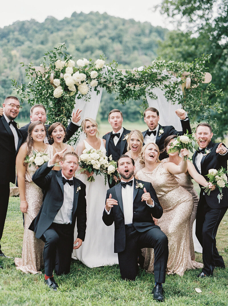 Bridal party cheering during estate wedding celebration – Washington DC Wedding Photographer