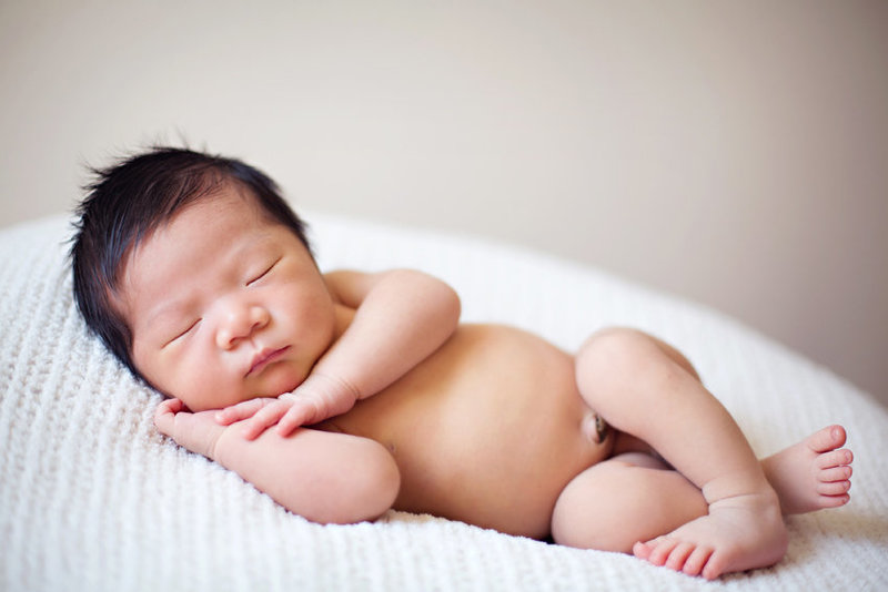 newborn Asian baby sleeping during his newborn session