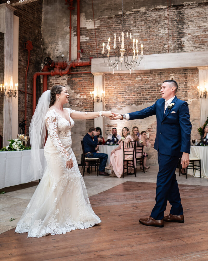 Bride and groom dance during Gallery Venue at Tomas Bistro wedding