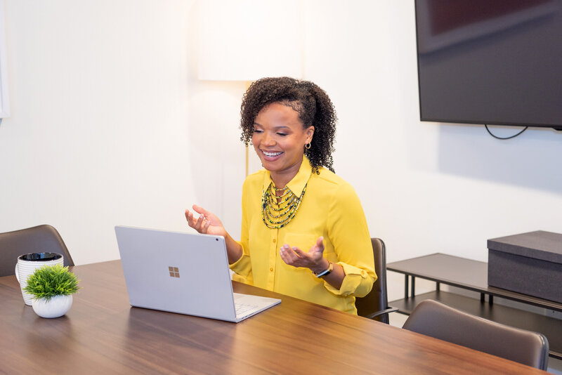 A small business attorney talking to her client on a video call in a conference room in Short Hills, New Jersey.