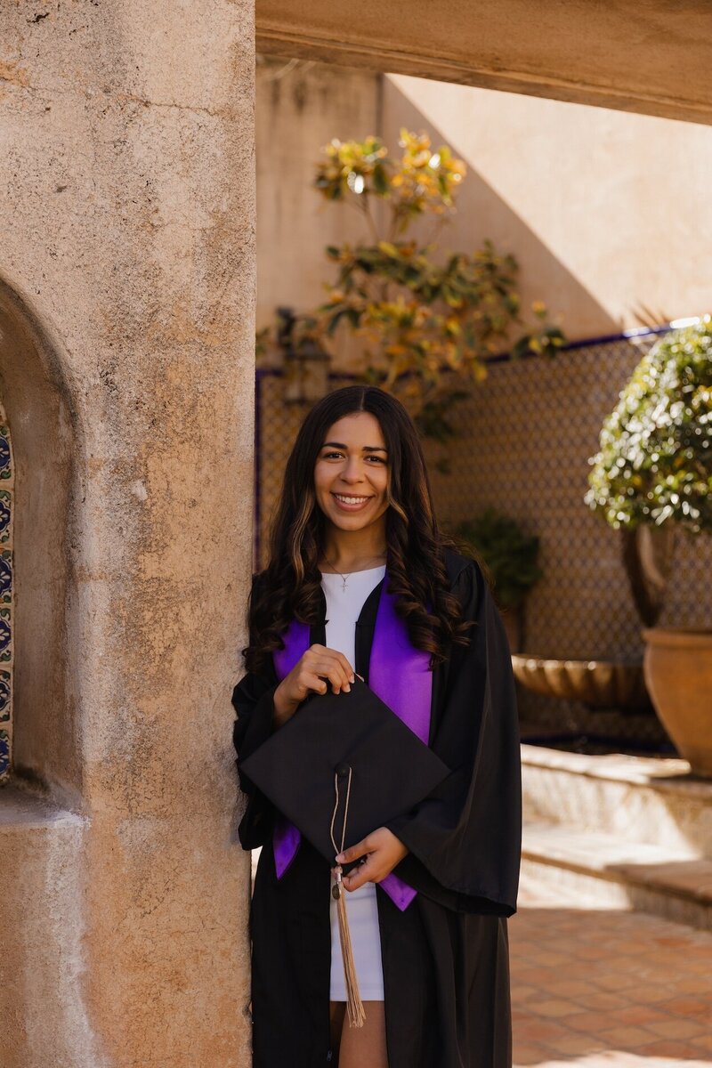 girl poses for graduation photos in arizona