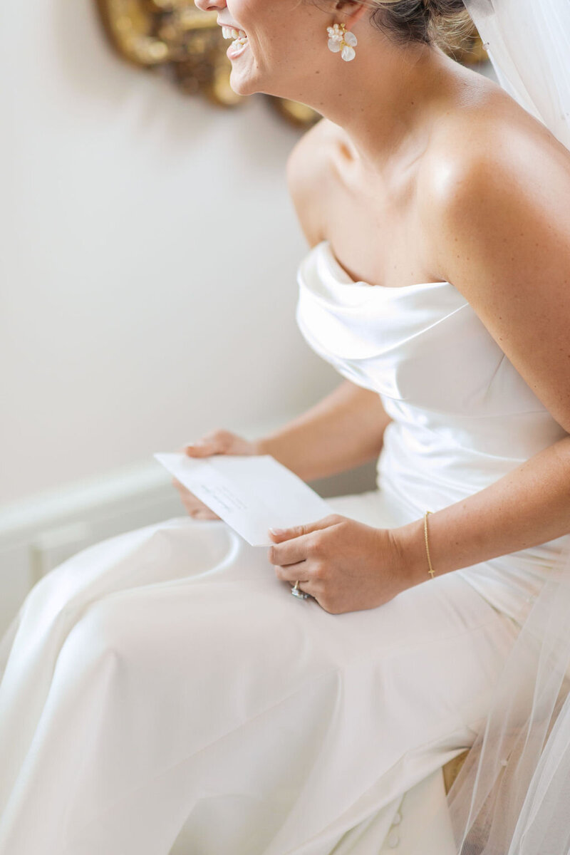 Bride reads letter on her wedding day