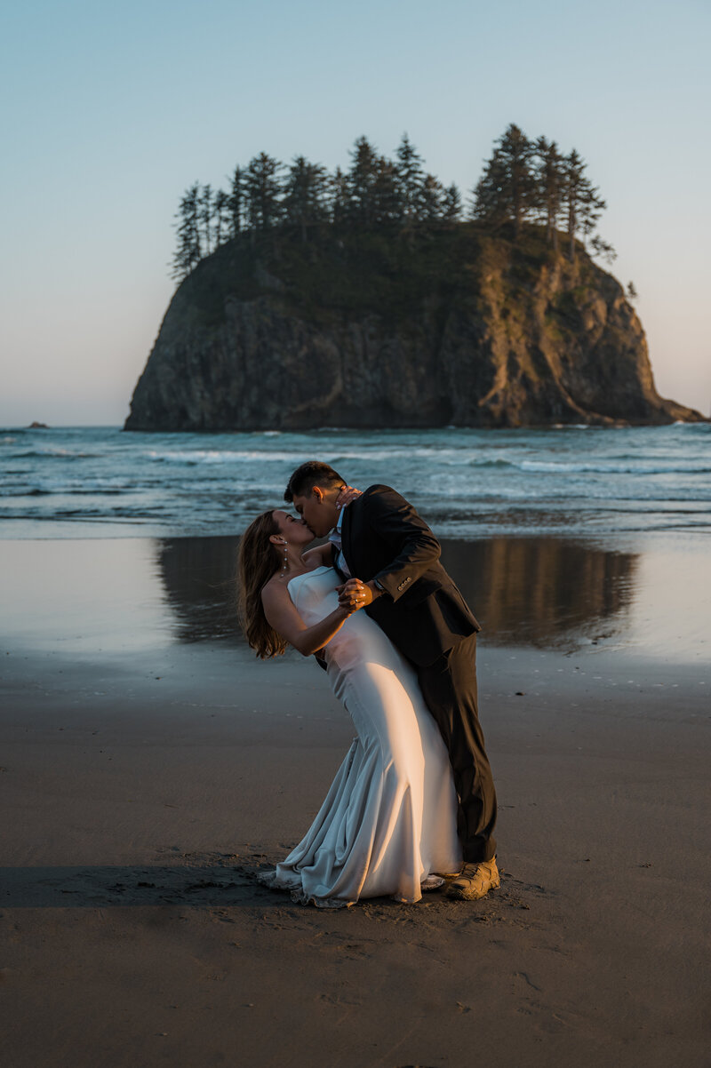 Couple sharing their first dance on Second Beach after eloping in Olympic National Park