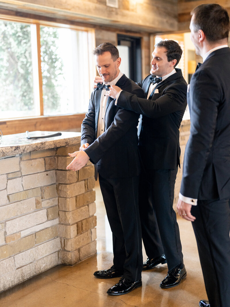 Groom preparing for ceremony in the groom’s suite at Canyonwood Ridge