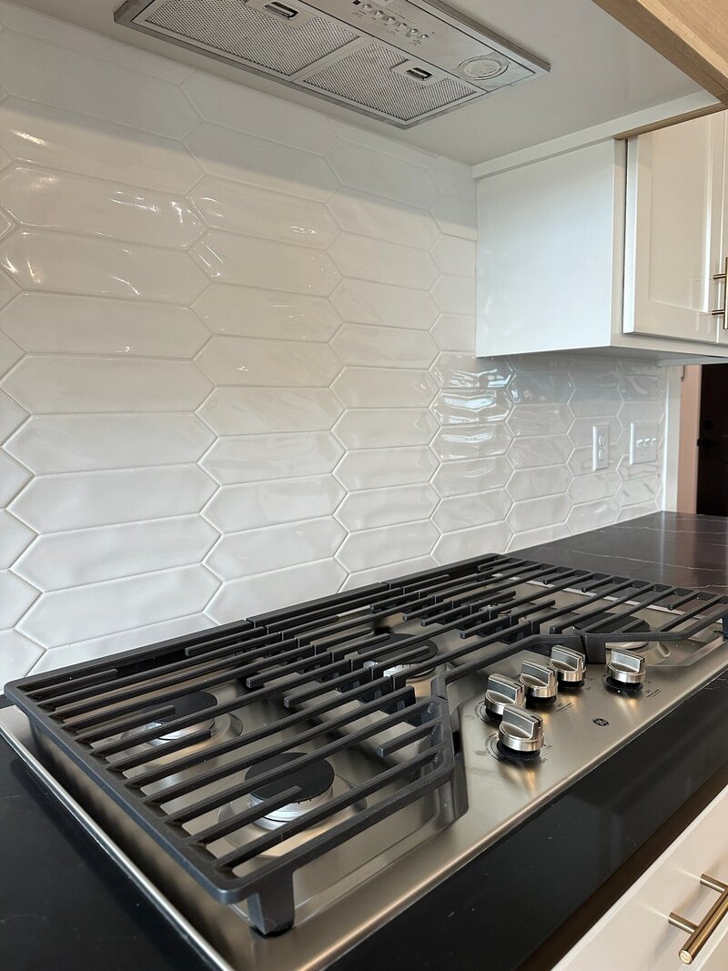 White backsplash tile in a kitchen.
