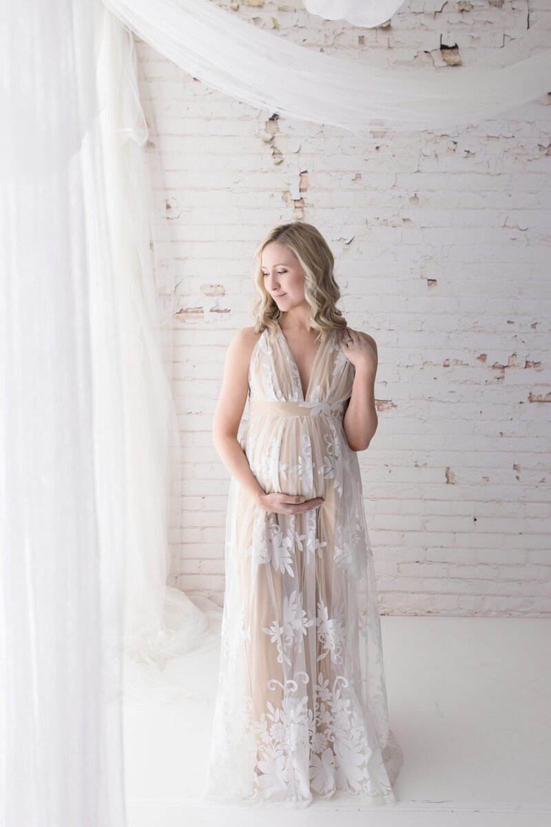 A baby girl celebrates her birthday with a Cleveland Cake Smash Photographer Mary Christine Photography
