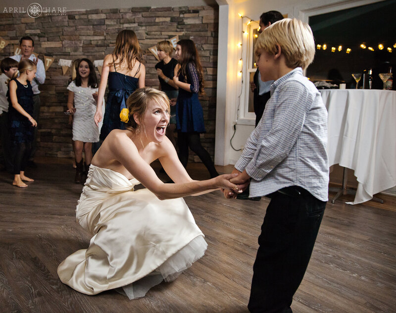 Bride dances with nephew at her wedding reception at Boulder Creek Wedgewood Weddings