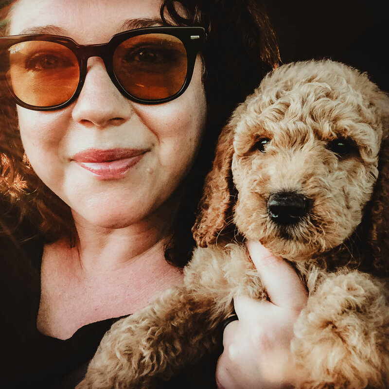 Desiree holding a Poodle Puppy