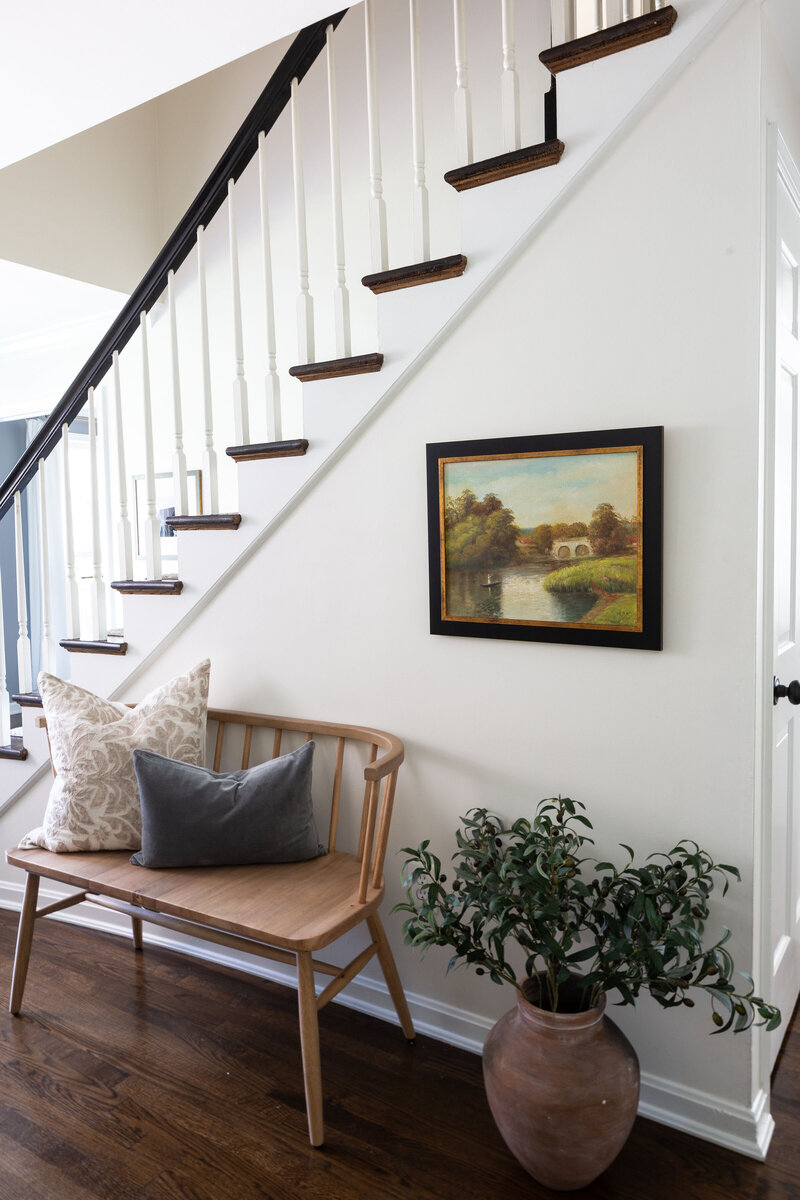 Traditional stairs with entryway bench
