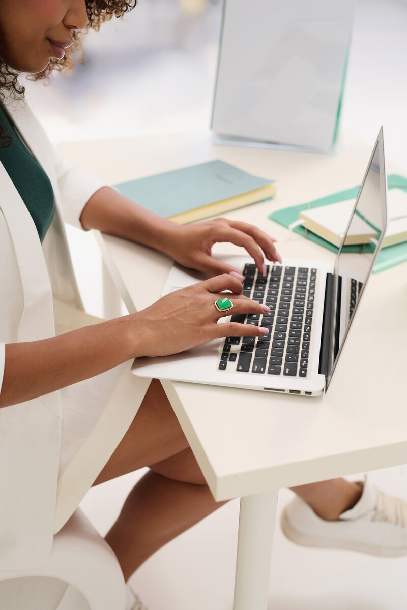 woman typing on laptop