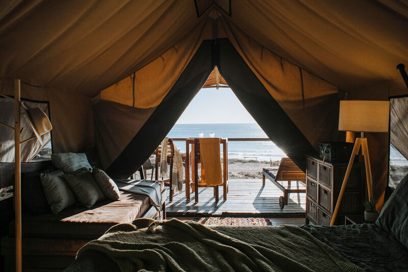 A cozy eco tent looking out to the ocean