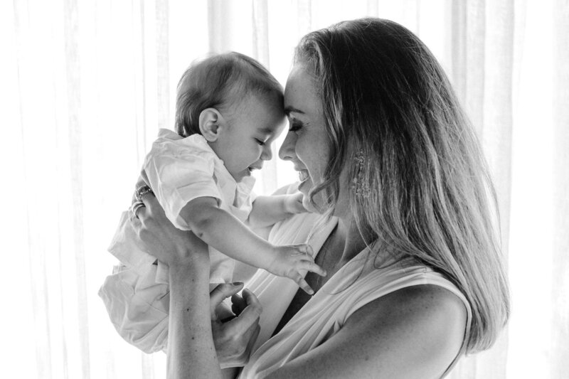 Mother holding her baby with love and care. 