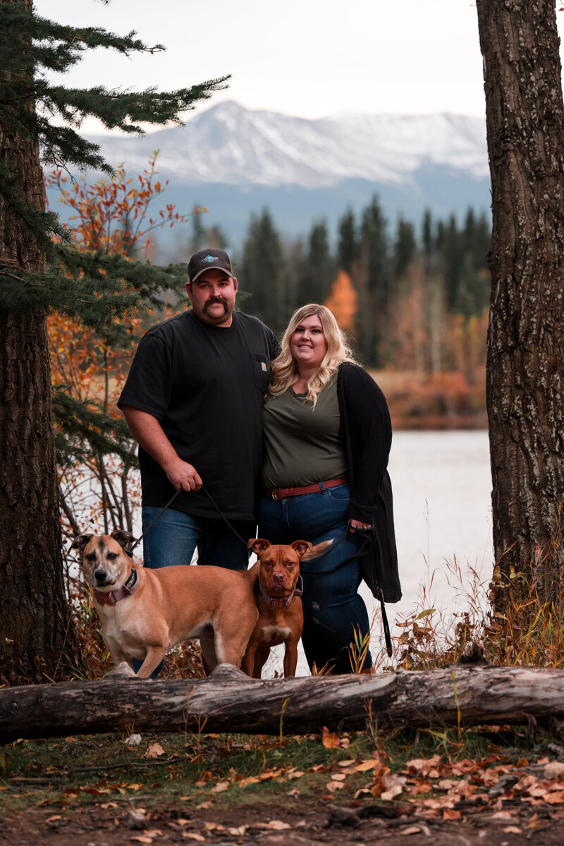 Family Photo of Edmonton Photographer and her husband and dogs in the mountains in Alberta