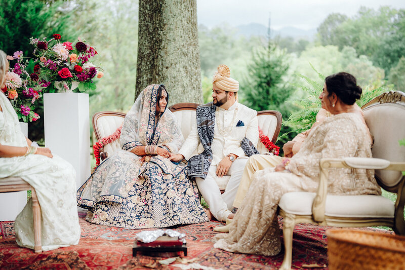 Bride and groom sitting at their Indian wedding ceremony, taken by Asheville Wedding Photographer Simon Anthony Photography