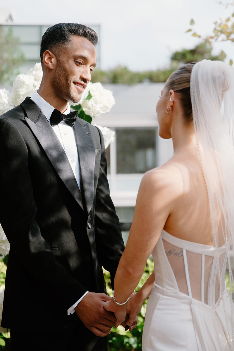 A couple saying their vows during an elopement wedding ceremony in downtown manhattan. 