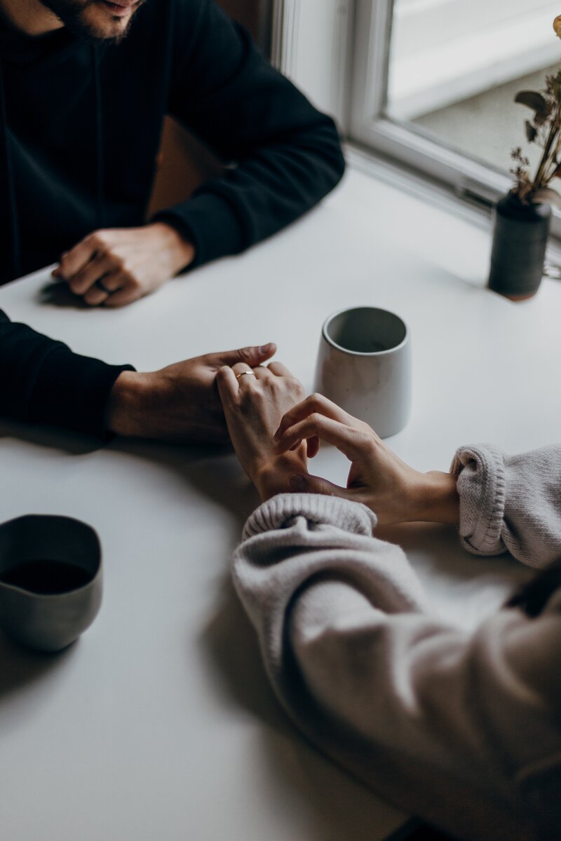 Married couple having coffee and deciding to contact Dr. Elizabeth Perri for therapy