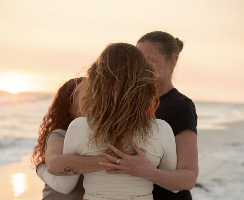 group hug on the beach 