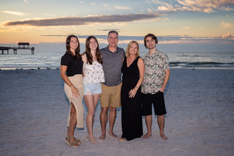 family photograph on the beach by Lyndsey Livingston Photography