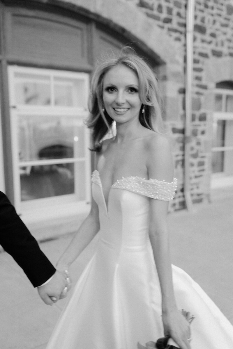 A bride and her bridesmaid get dressed