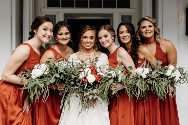 bride and bridesmaids holding bouquets