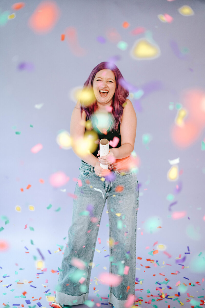 Photography Business Coach | Karinda K. | Karinda popping a confetti