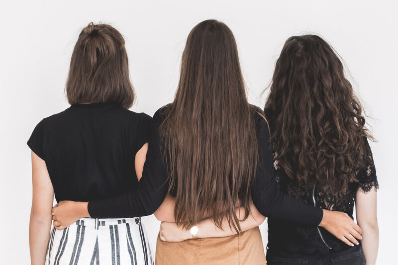 Group of women holding each other at the hips
