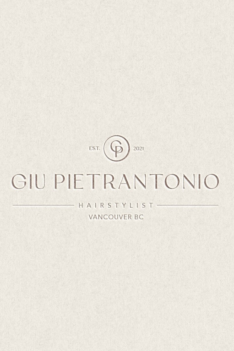 Brand image of hairstylist spraying hairspray on new haircut