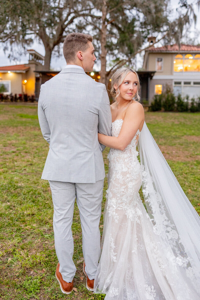 bride and groom looking back to their guests after wedding ceremony