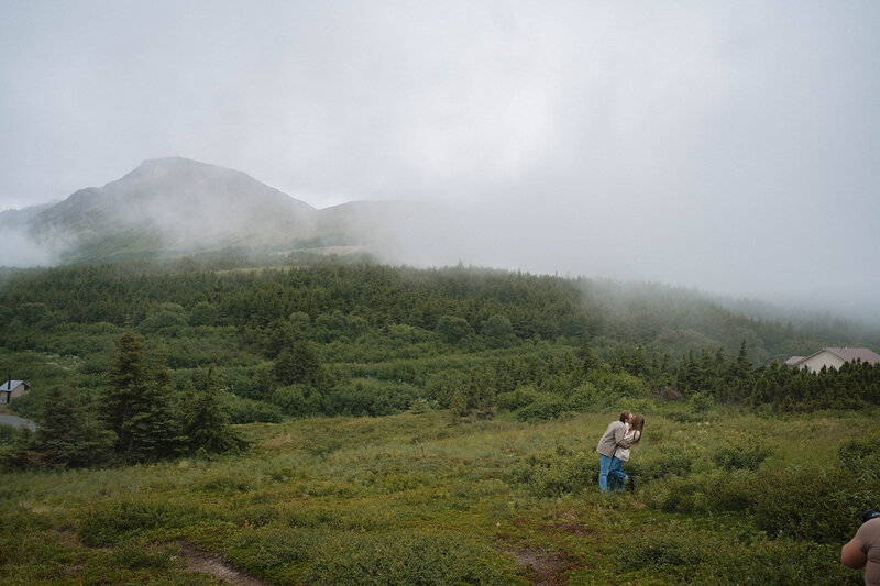 elopement couple hold their dog in their arms